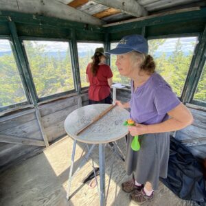 2 hikers inside the fire lookout