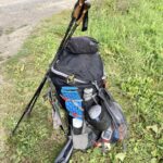 packed backpack with hiking poles