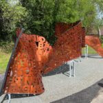 A winding copper colored sculpture