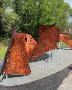 A winding copper colored sculpture