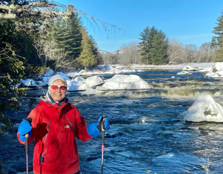 Skier by a river