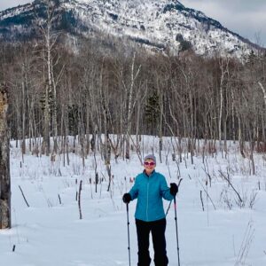 Skier in front of a mountain