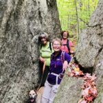 Hikers in the split of a rock