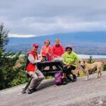 A group of hikers at the summit