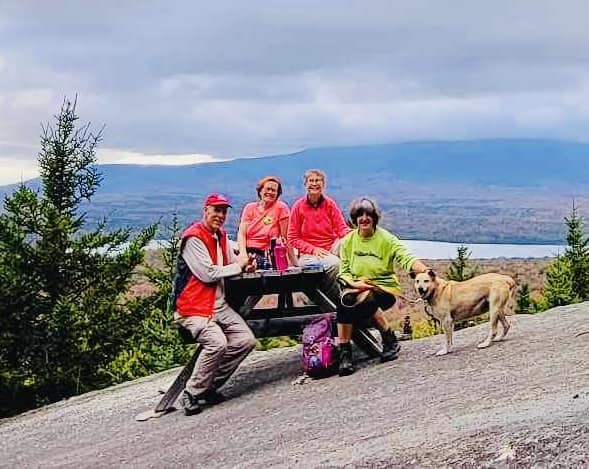 A group of hikers at the summit