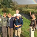 Earl, Rebecca, Inga, Ed Friedman, Inga's partner Mark, and Phine celebrate the sun halfway through the hike to Donegal Town.